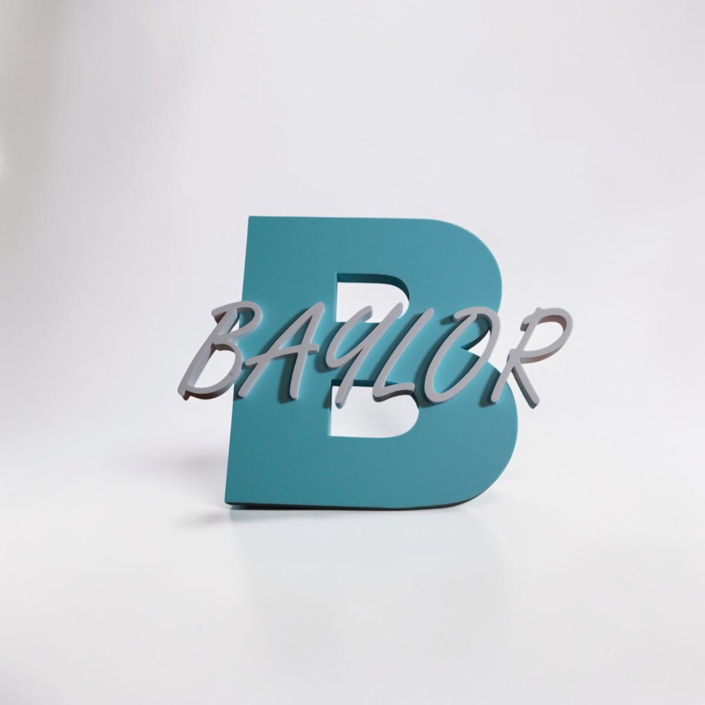 Teal letter 'B' with 'Baylor' in silver on a white background