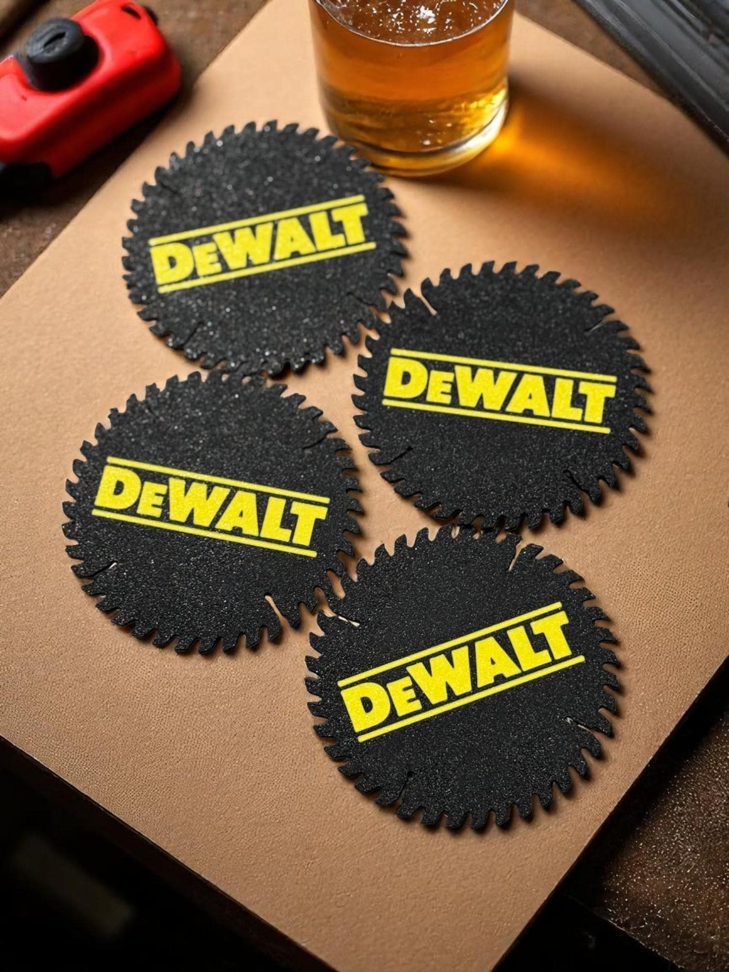 Coasters placed under a drink on a garage workbench