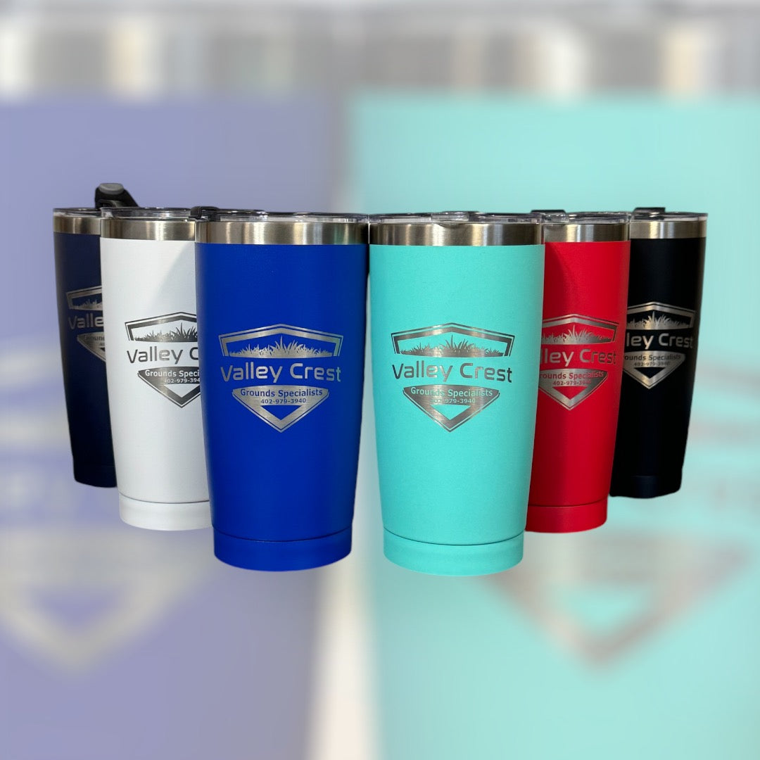 Set of Valley Crest branded tumblers in various colors on a reflective surface.