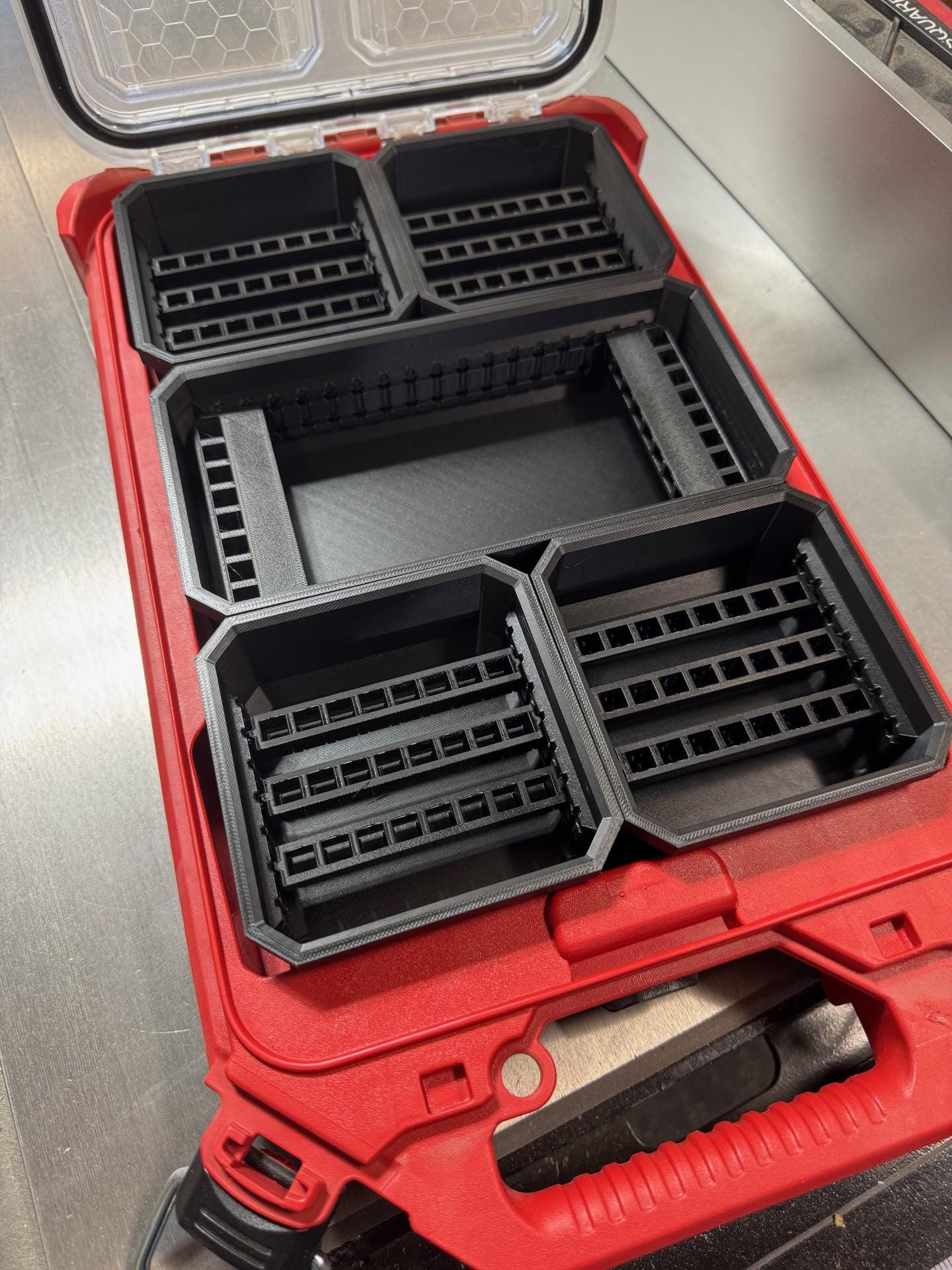 Bit Bins designed for use with the Milwaukee Low-Profile Compact Small Parts Organizer. Made from durable PETG, this set includes all holders shown in the images: four small square bins and one long rectangular bin.