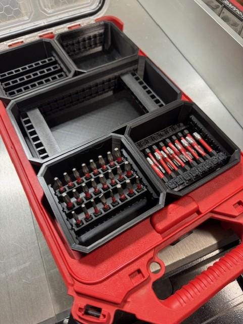 Bit Bins designed for use with the Milwaukee Low-Profile Compact Small Parts Organizer. Made from durable PETG, this set includes all holders shown in the images: four small square bins and one long rectangular bin.