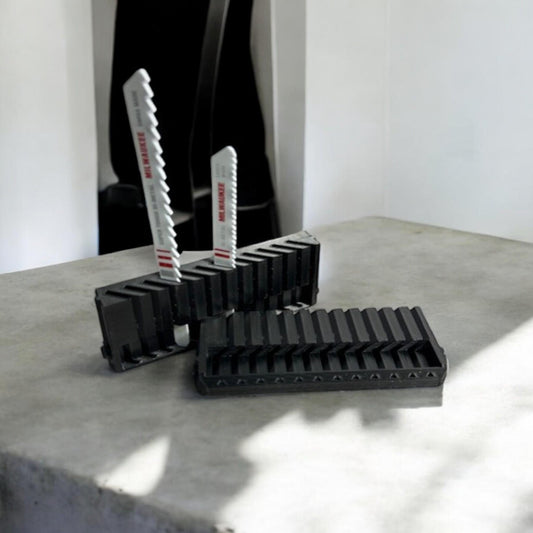 Set of two 3D-printed Milwaukee Packout jigsaw blade holders with blades snapped in for secure storage and transport.