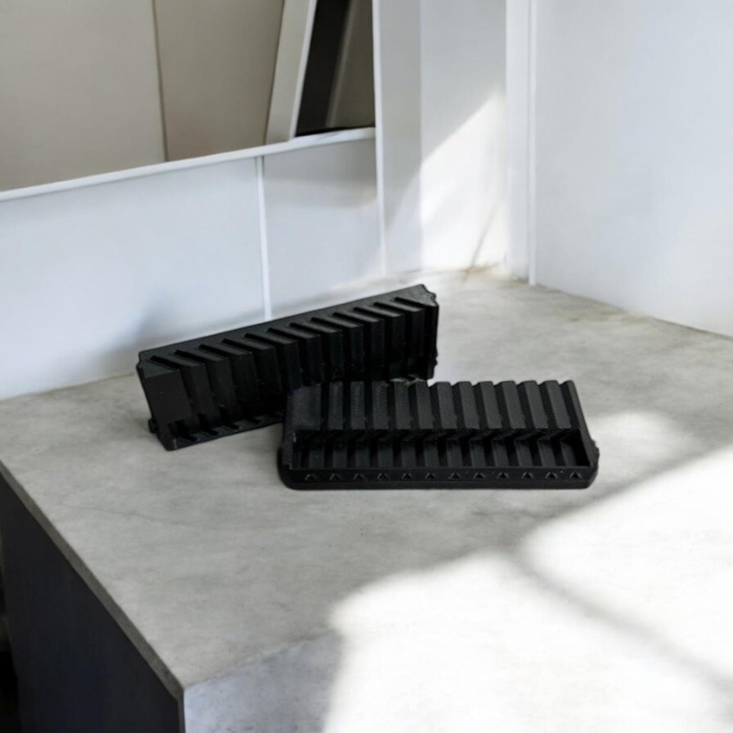 Set of two 3D-printed Milwaukee Packout jigsaw blade holders with blades snapped in for secure storage and transport.