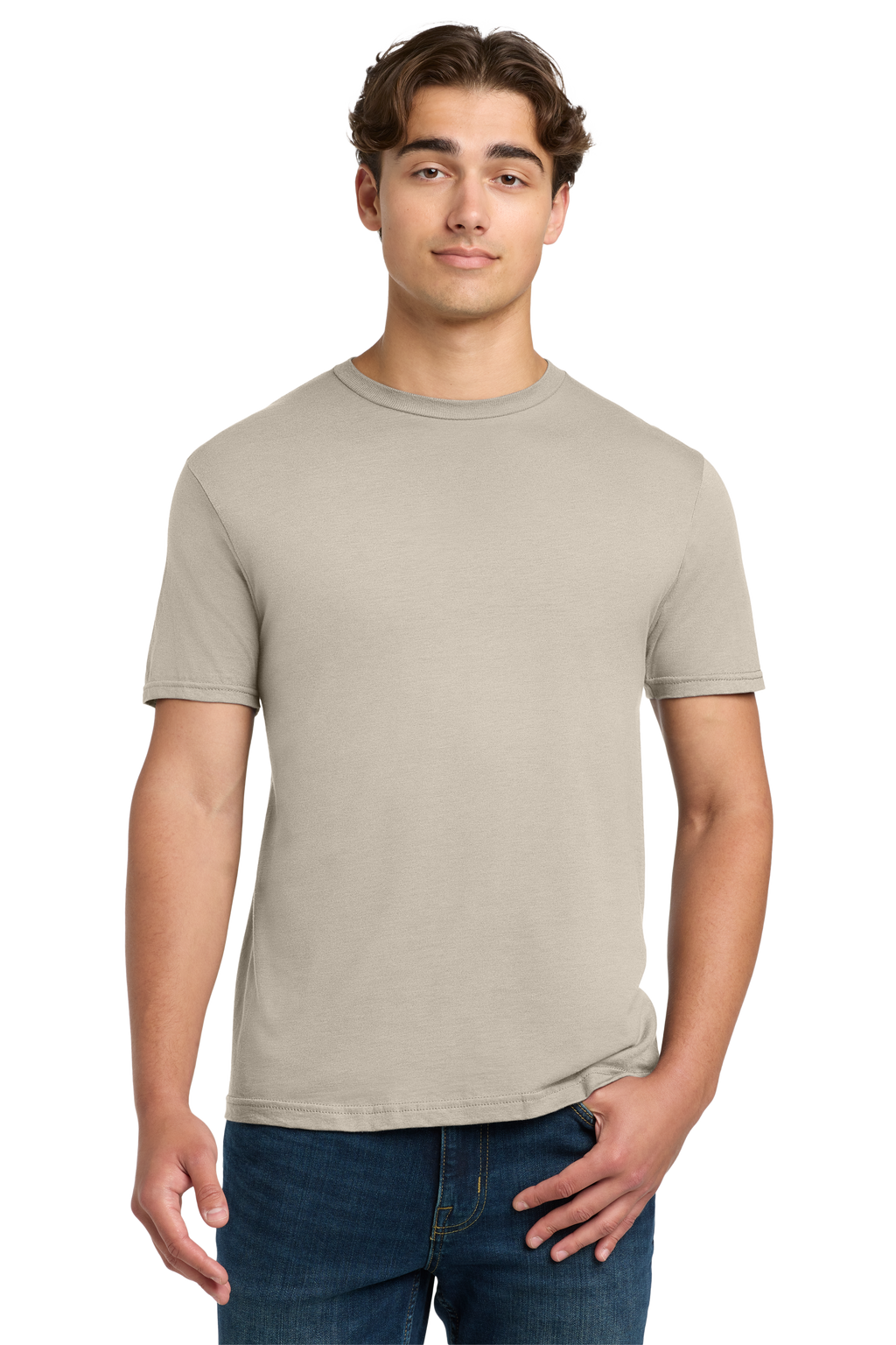 Man wearing a beige t-shirt and blue jeans on a white background