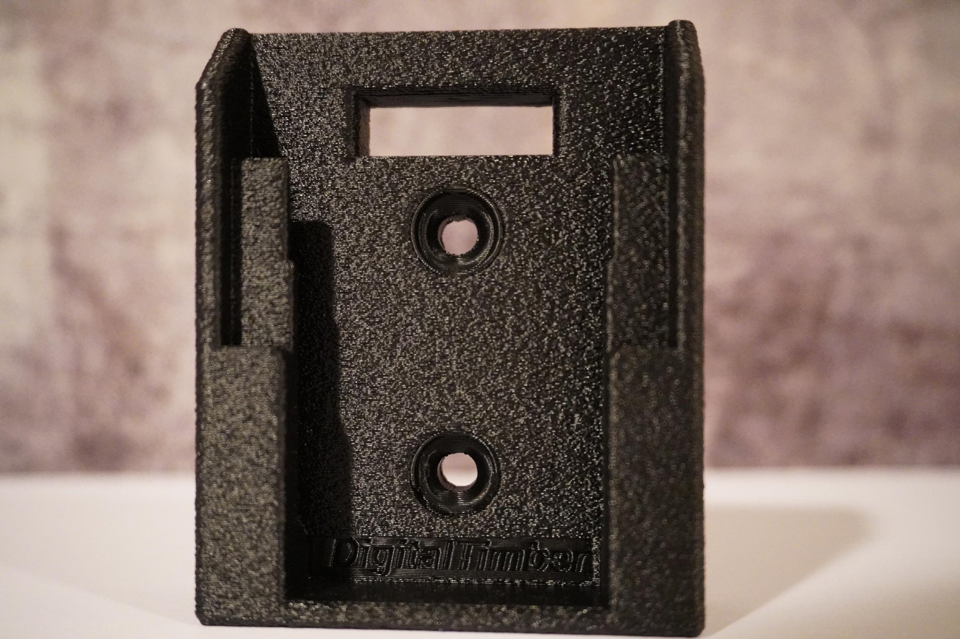 Close-up of DeWalt 20V battery holder with DigitalTimber logo on a textured background