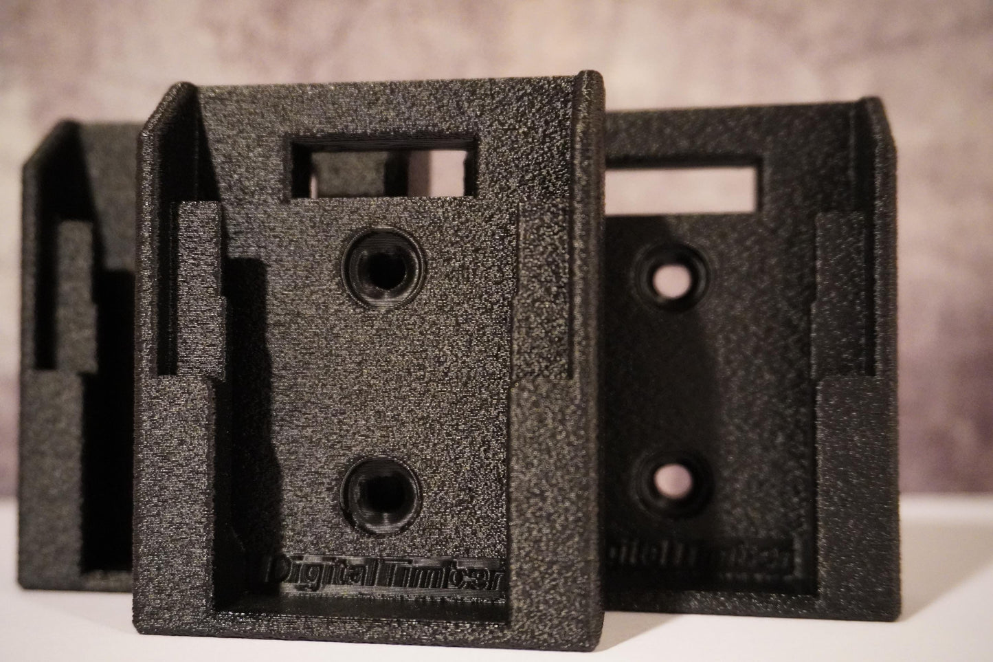 Front view showing dual screw holes and battery slide mount detail