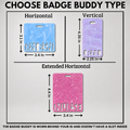 A product information graphic showing three badge buddy options with dimensions and text labels: a horizontal light blue marbled badge with 'RMSN' cutout, a vertical lavender marbled badge with 'CRNT' cutout, and an extended horizontal pink glitter badge with 'NURSE' cutout. The top text reads 'CHOOSE BADGE BUDDY TYPE' and the bottom text explains the badge is worn behind the ID and does not have a slot.