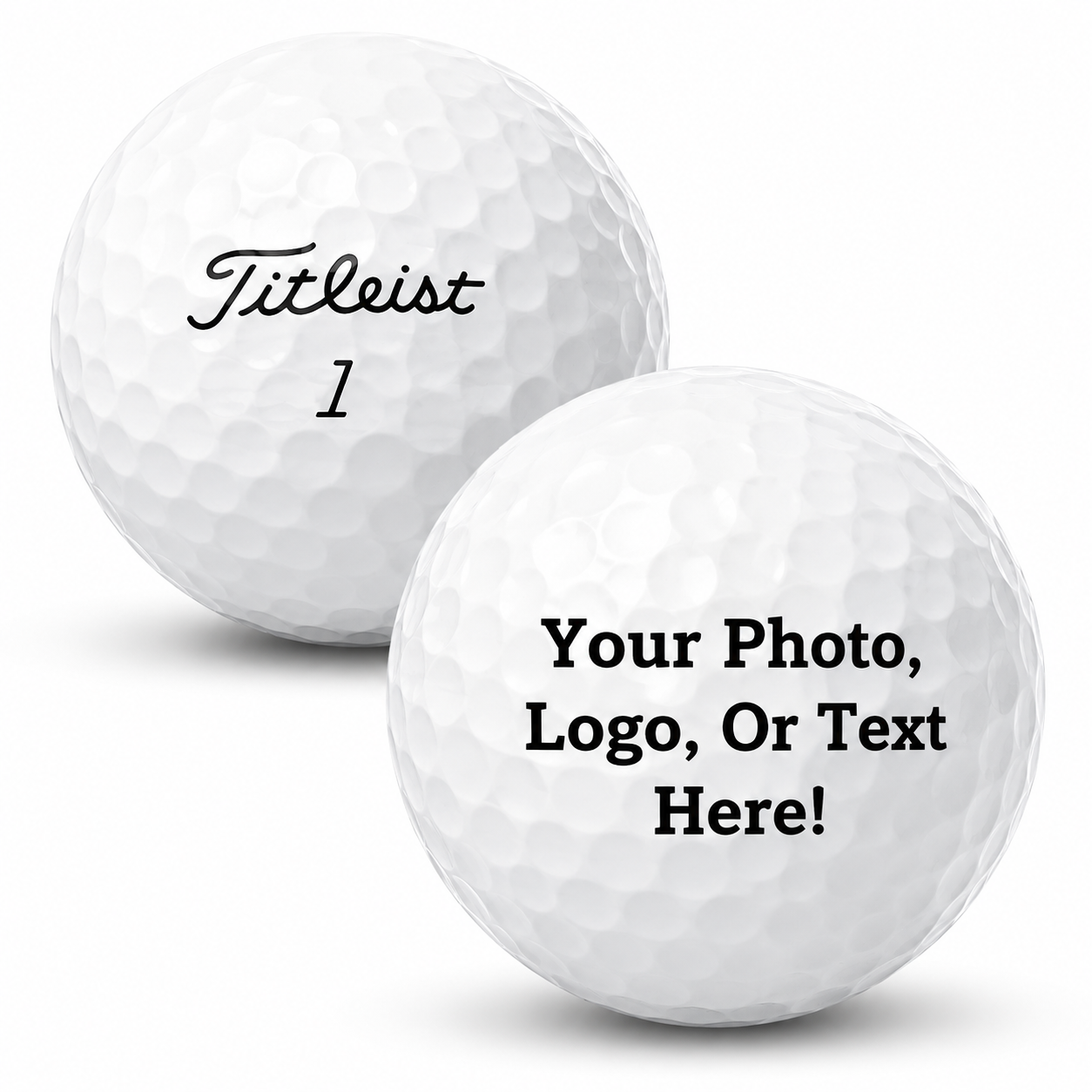 Two white dimpled golf balls on a light gray background. The left ball is printed with the word 'Titleist' in black script and the number '1' below it.