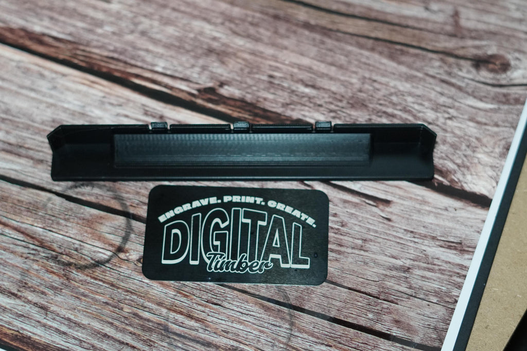 Back view of the replacement label showing mounting clips
