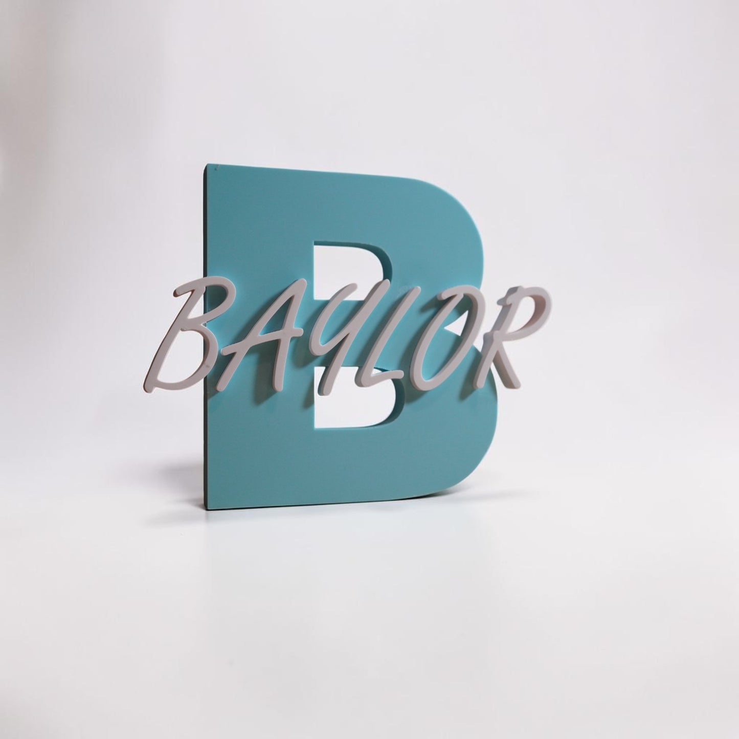 Teal letter 'B' with 'Baylor' in white on a light gray background
