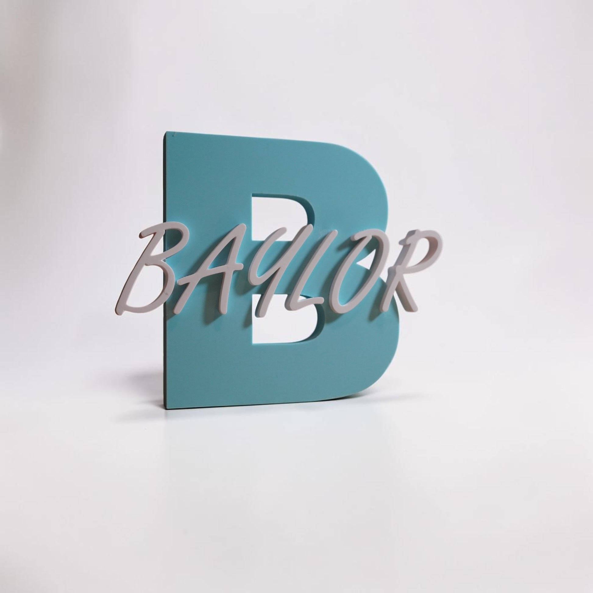 Teal letter 'B' with 'Baylor' in white on a light gray background