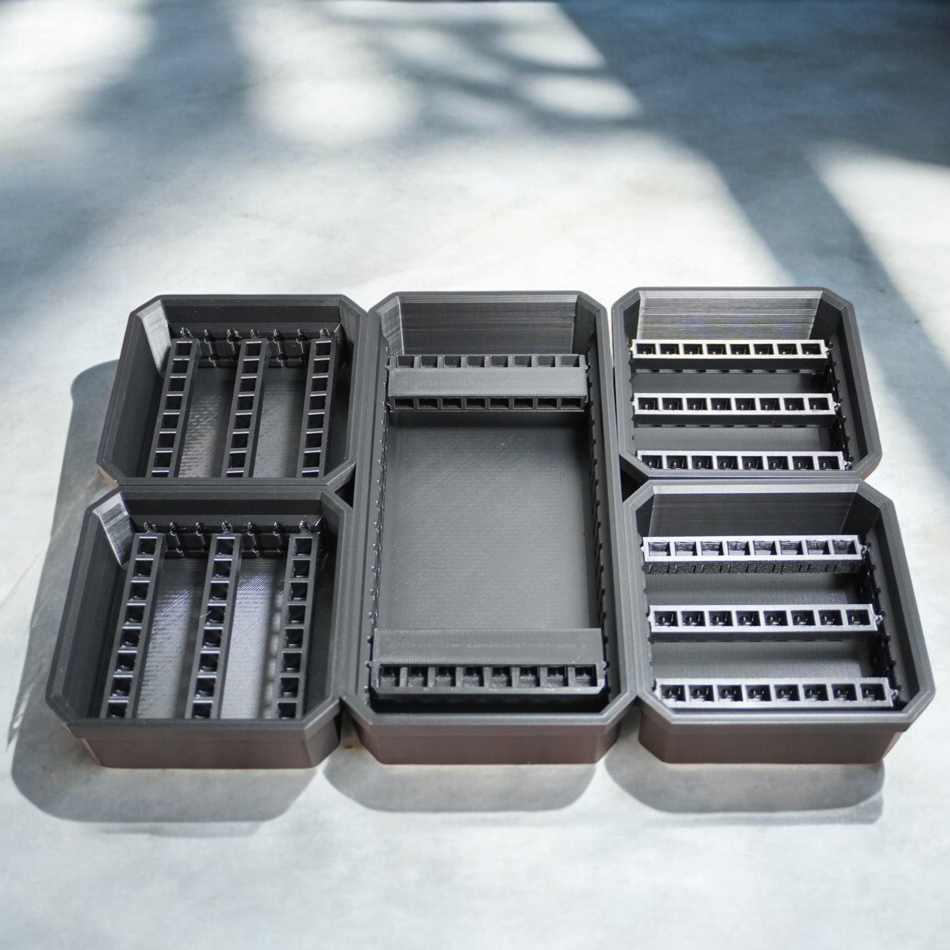 Bit Bins designed for use with the Milwaukee Low-Profile Compact Small Parts Organizer. Made from durable PETG, this set includes all holders shown in the images: four small square bins and one long rectangular bin.