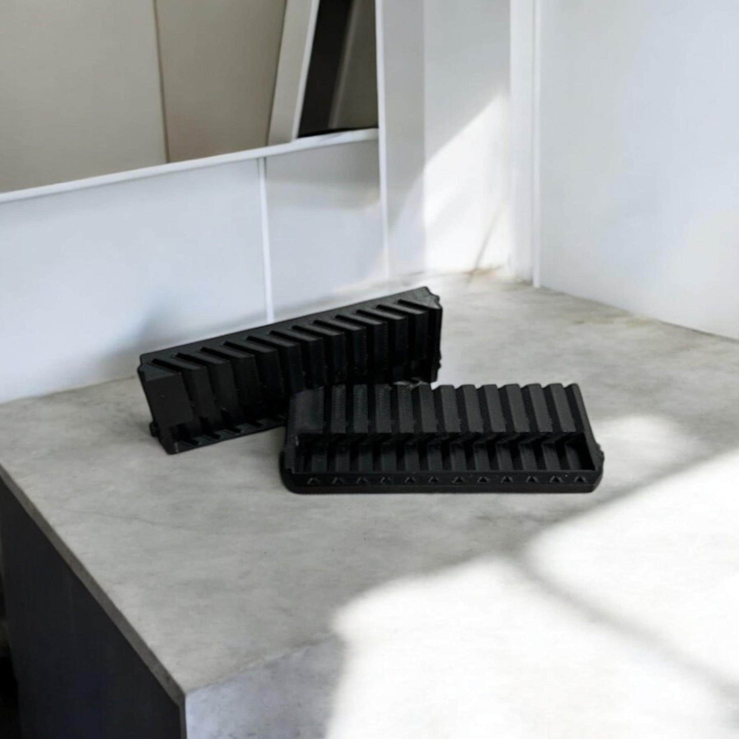 Set of two 3D-printed Milwaukee Packout jigsaw blade holders with blades snapped in for secure storage and transport.