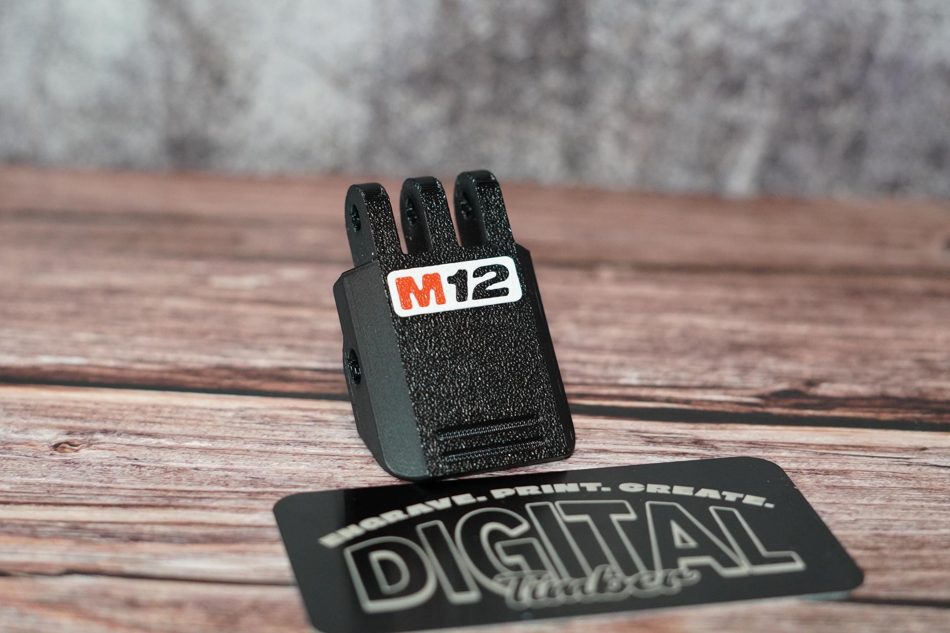 Front angle of the M12 latch on wood background – "Close-up of Milwaukee M12 latch replacement on display