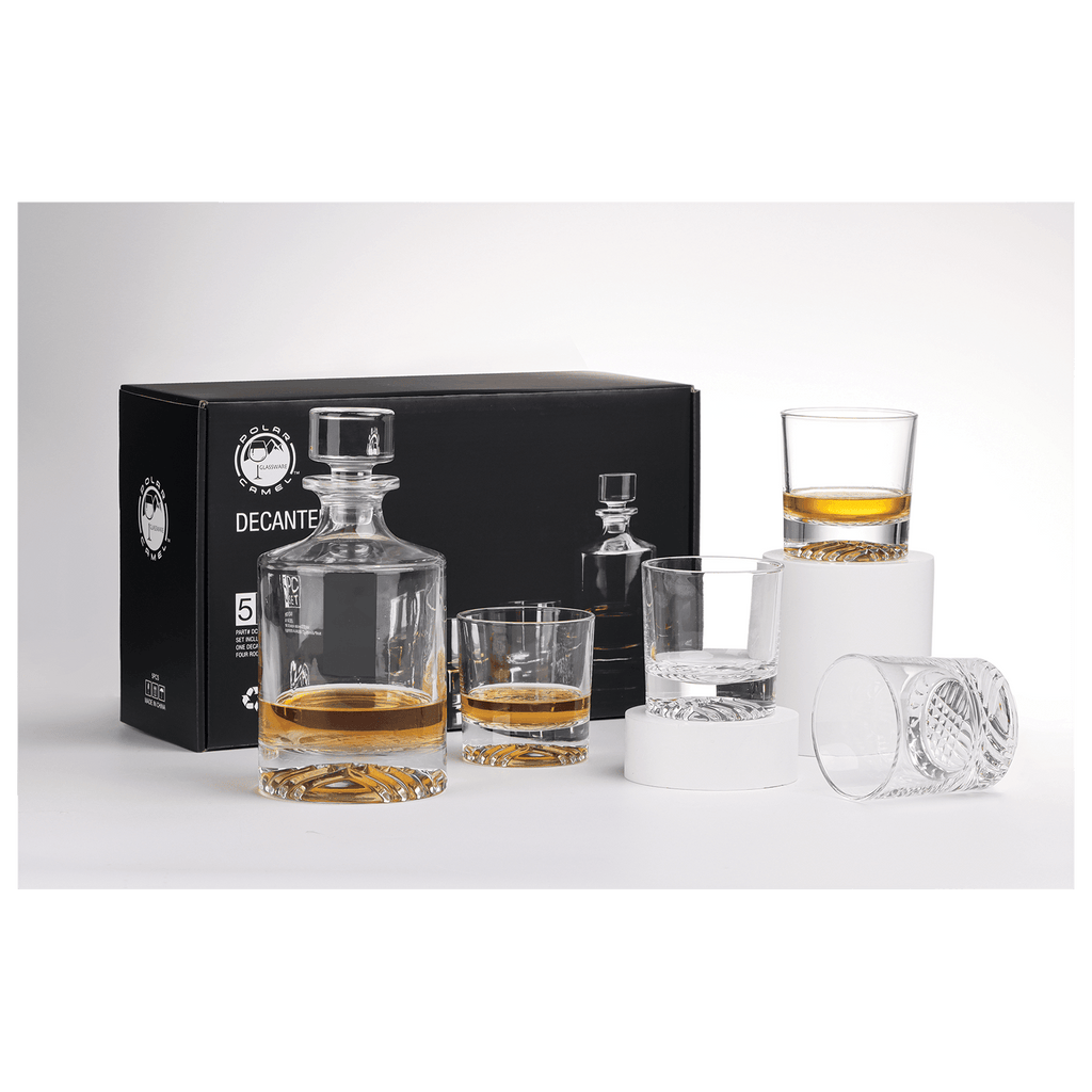 Whiskey decanter set with glasses on a white surface