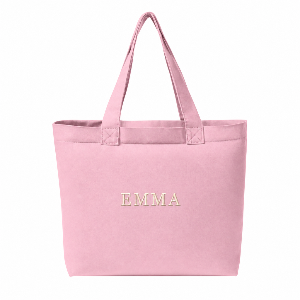 Rose Quartz Comfort Colors CCET0 tote with sample cream EMMA embroidered name centered on the front panel — placement mockup