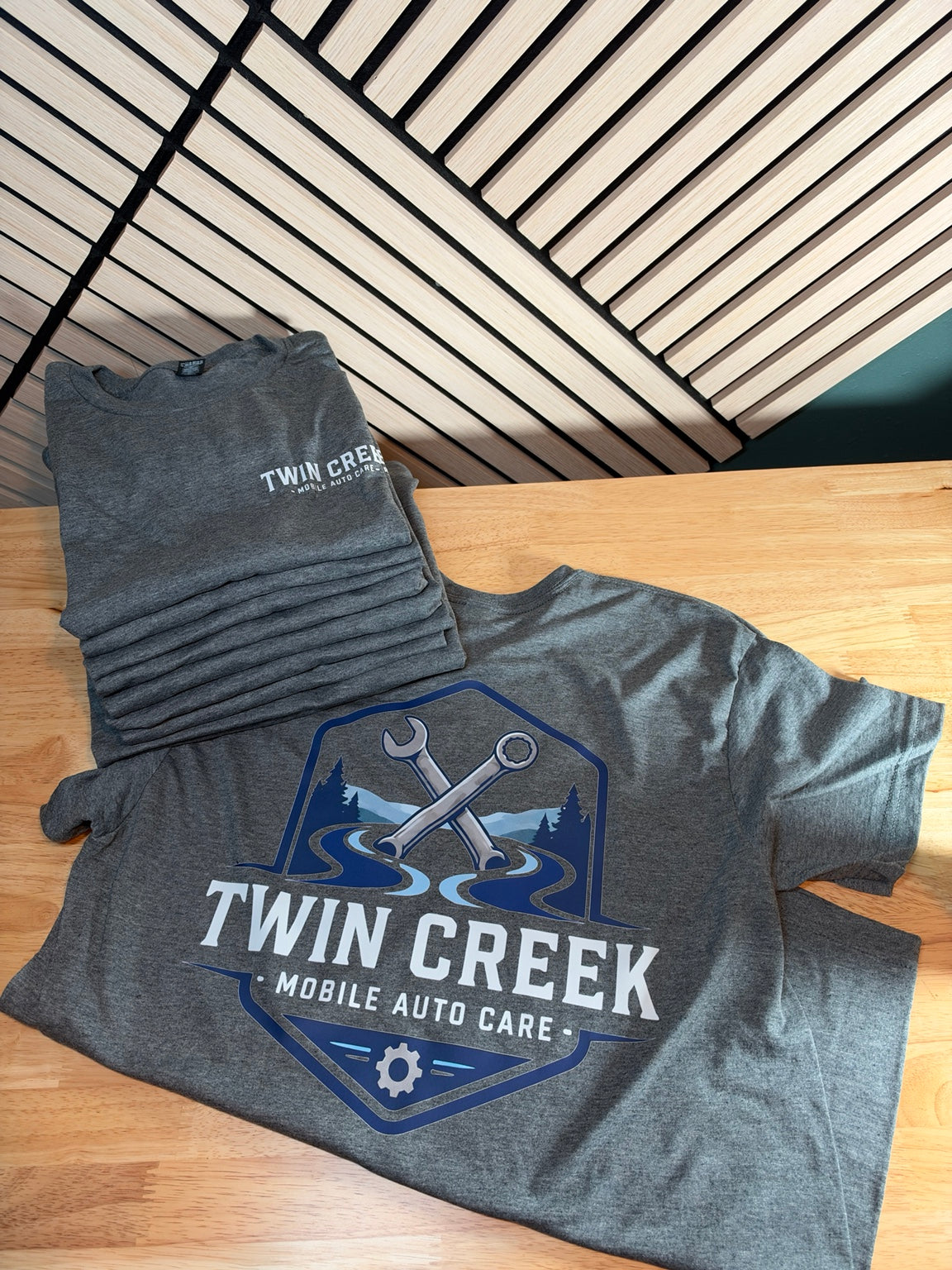 Finished custom printing example: gray Gildan Softstyle 64000 shirts with Twin Creek Mobile Auto Care left-chest and full-back designs