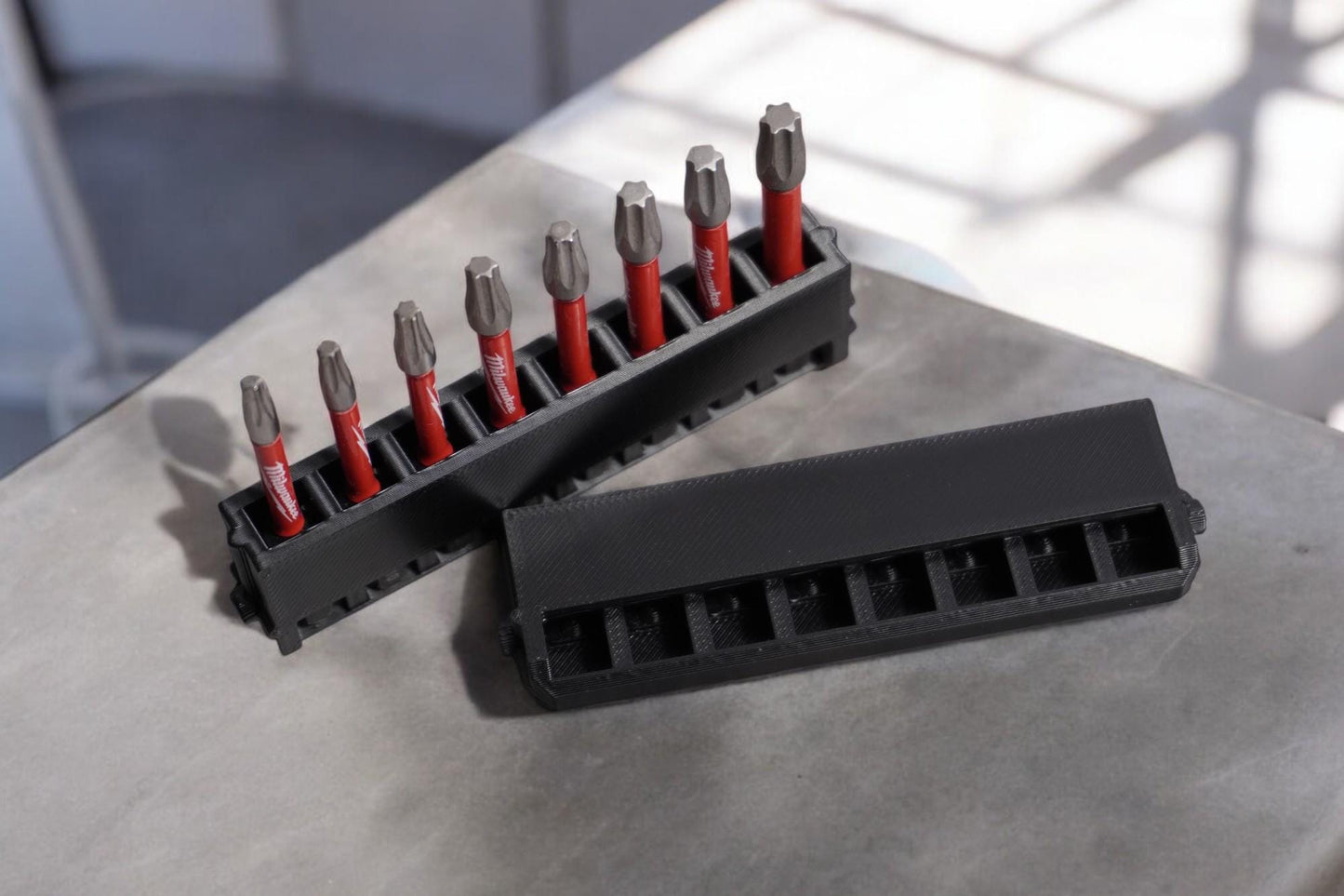 long bit holder with a black design, featuring a secure cover and slots for multiple drill bits. (etsy image id: 6531721882)