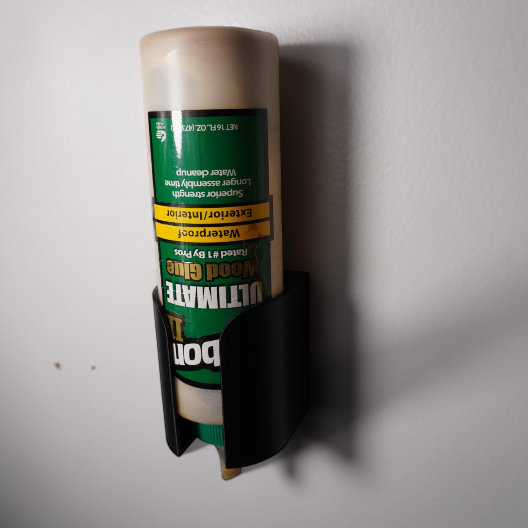 3D-printed glue bottle holder, made from PETG plastic. Designed to securely hold your glue bottle upside-down for smooth flow or upright for stability, it’s perfect for woodworkers (etsy image id: 6577613527)