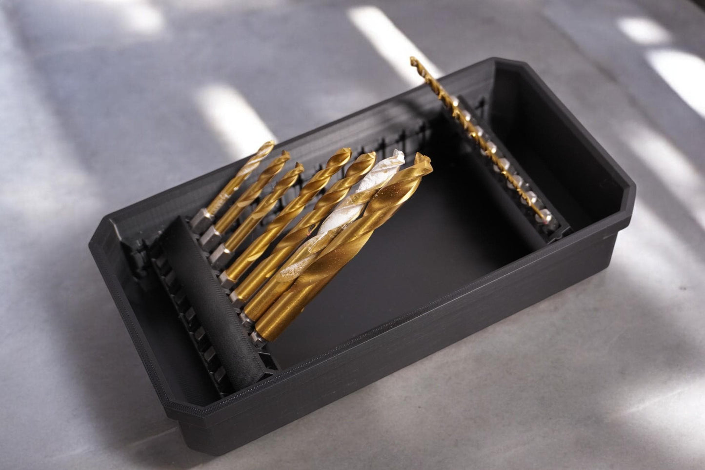 long bit holder with a black design, featuring a secure cover and slots for multiple drill bits. (etsy image id: 6579841723)