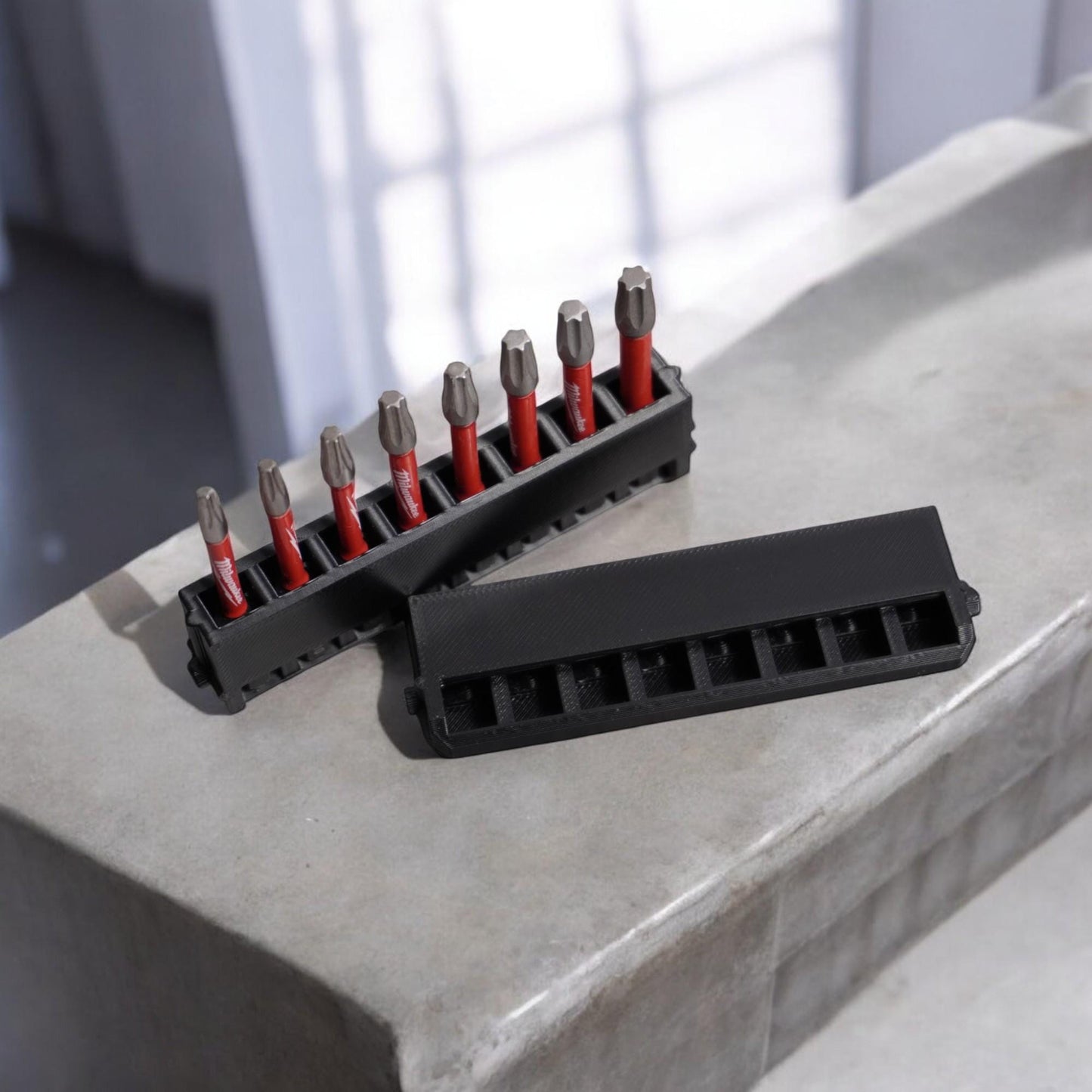 long bit holder with a black design, featuring a secure cover and slots for multiple drill bits. (etsy image id: 6579841725)