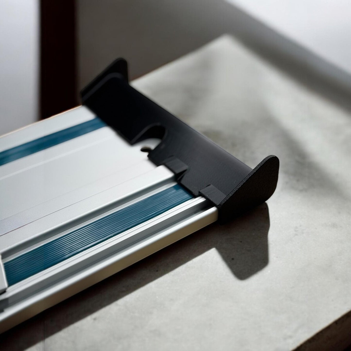 Side-mounted track saw cord deflector securely attached to guide rail (etsy image id: 6628667337)