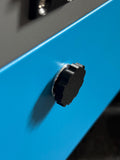 Set of 4 black 3D printed magnetic triangle knobs installed on OMTech laser machine