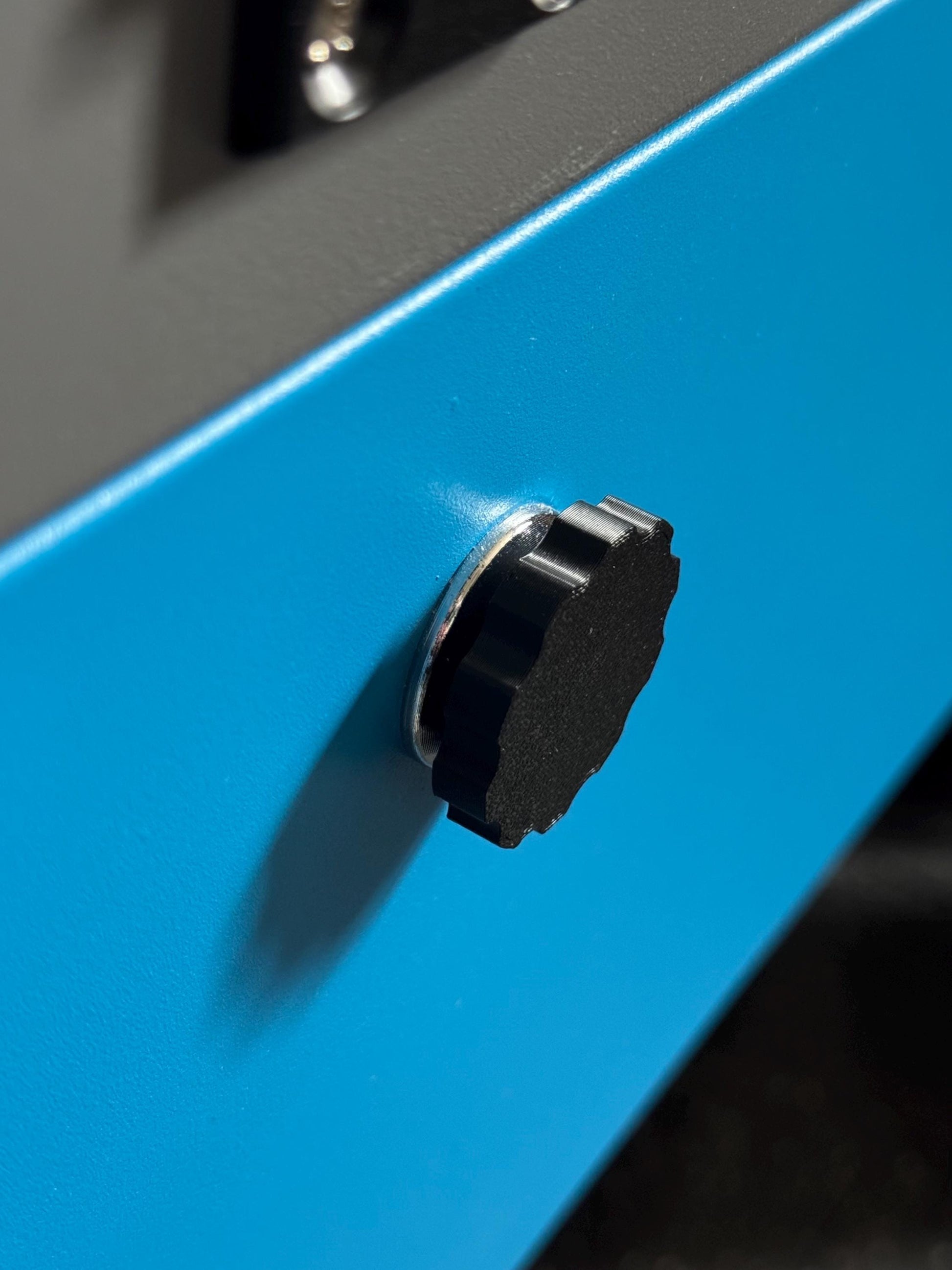 Set of 4 black 3D printed magnetic triangle knobs installed on OMTech laser machine for easy access and secure door operation (etsy image id: 6782524613)