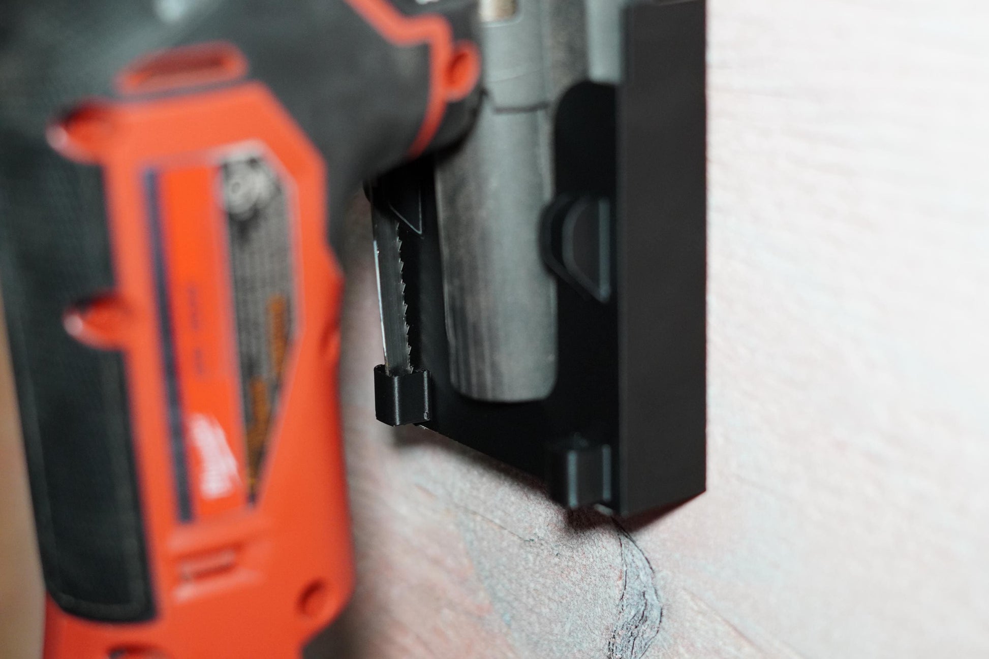 Milwaukee M18 jigsaw in black 3D printed mount from side view (etsy image id: 6789617316)