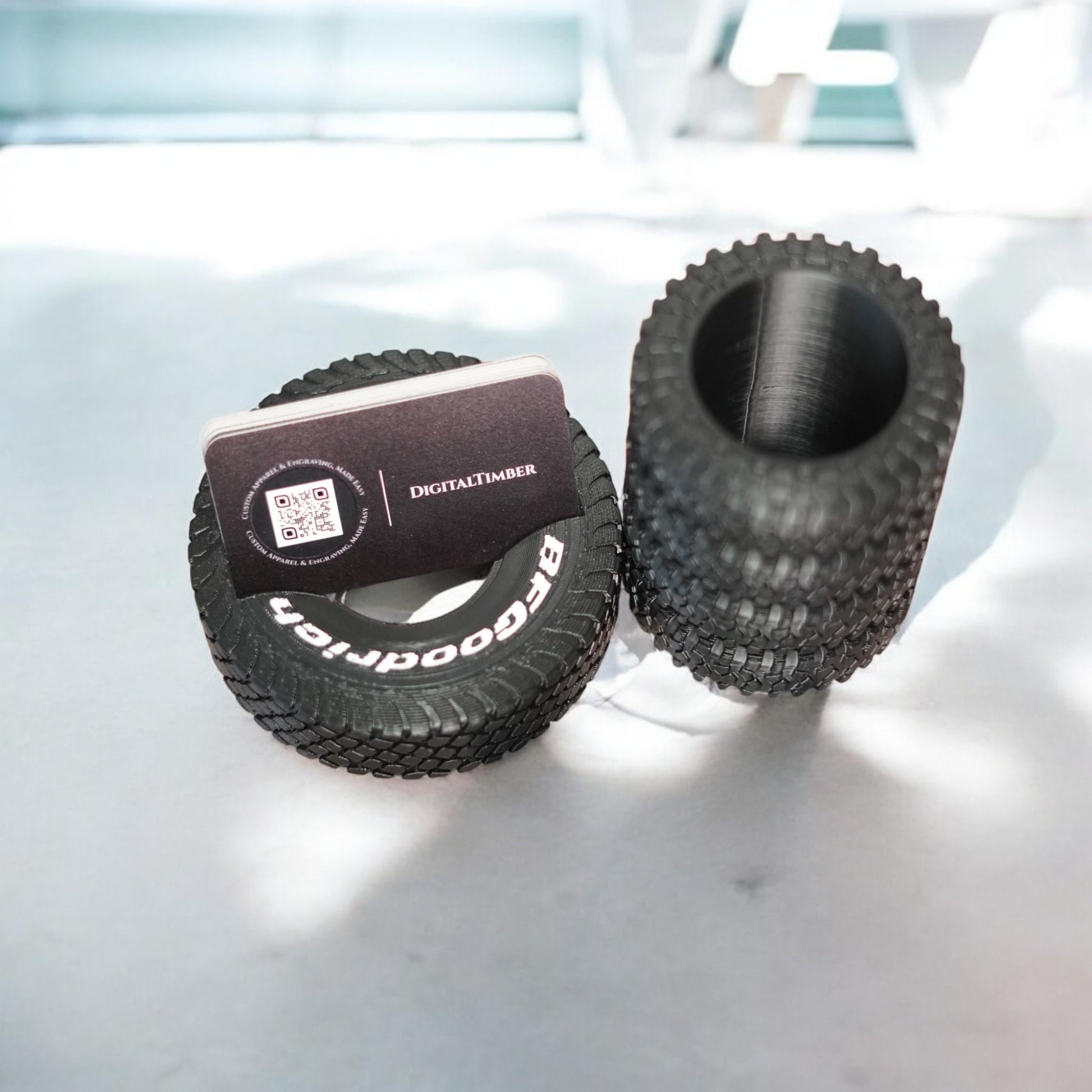 Two-piece desk organizer with off-road tire tread texture: one holds USB drive, the other holds a business card.  Made by DigitalTimber. (etsy image id: 6789746629)