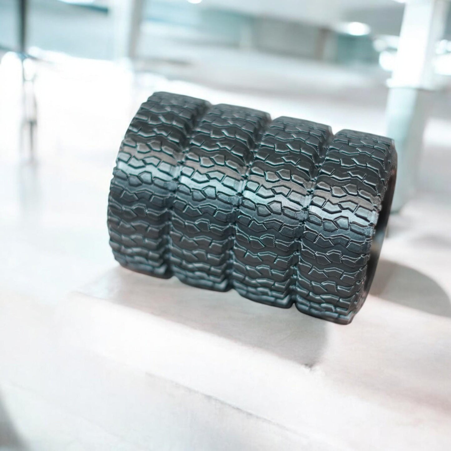 Side-by-side view of 3D-printed pen holder and card display with rugged off-road tire tread design on glass desk.  Made by DigitalTimber. (etsy image id: 6789746631)
