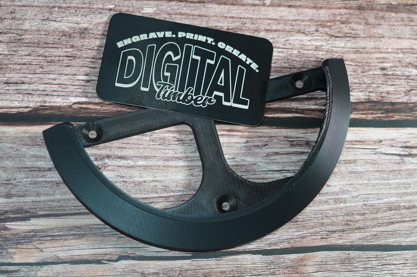 Black 3D-printed wall bracket for Mirka DEROS sander with mounting holes shown flat (etsy image id: 6797154565)