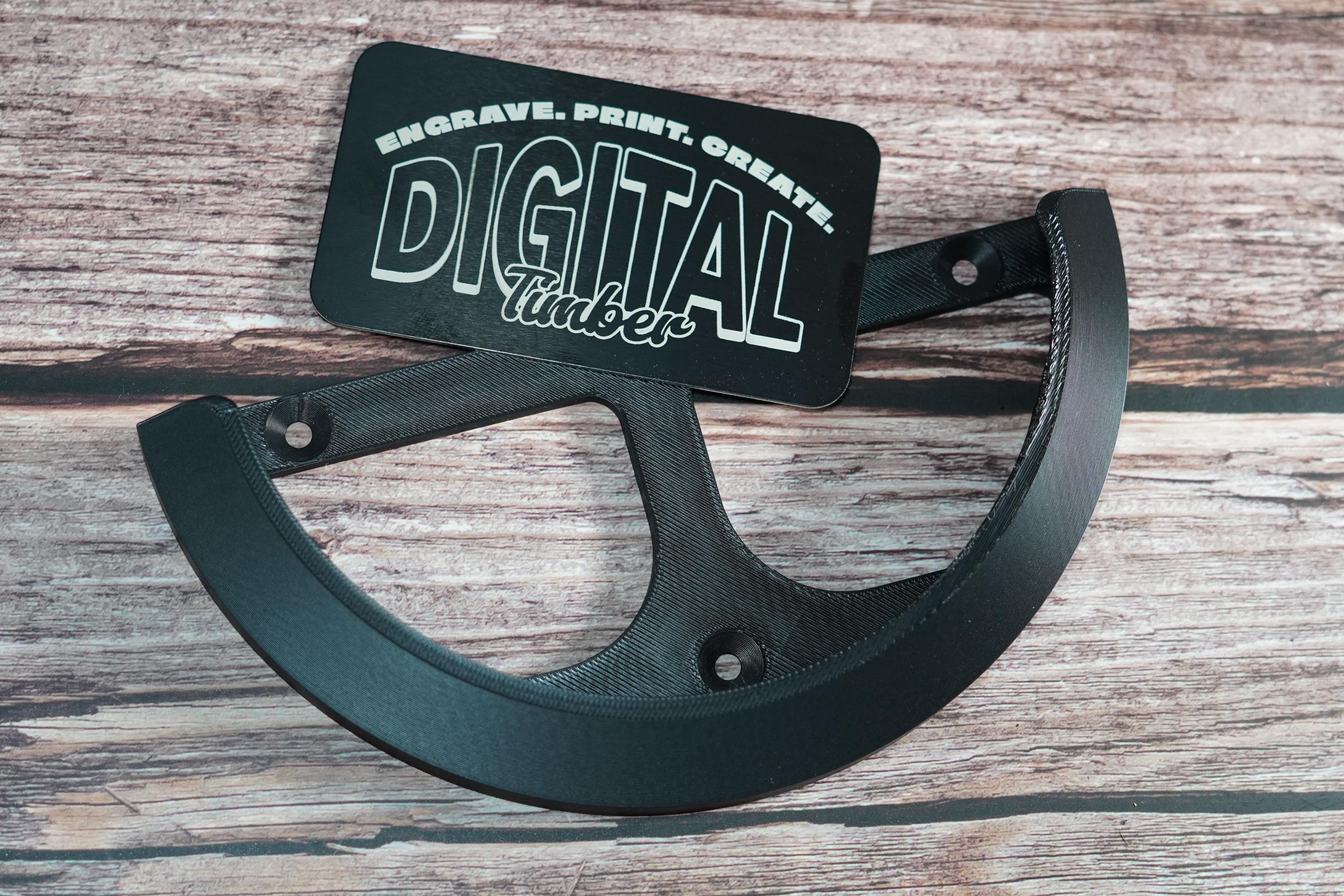 Black 3D-printed wall bracket for Mirka DEROS sander with mounting holes shown flat (etsy image id: 6797154565)