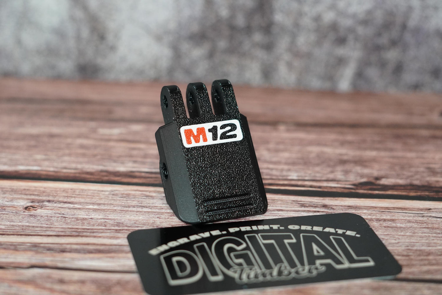 Front angle of the M12 latch on wood background – "Close-up of Milwaukee M12 latch replacement on display (etsy image id: 6797192944)