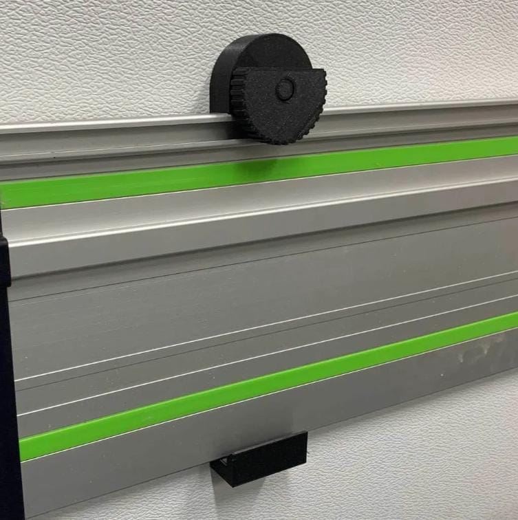 Black track saw rail securely mounted on white wall using custom 3D-printed bracket (etsy image id: 6797209233)
