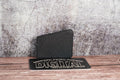 Arbor hole dust cover for Milwaukee M18 track saw standing upright on wood surface (etsy image id: 6797318933)