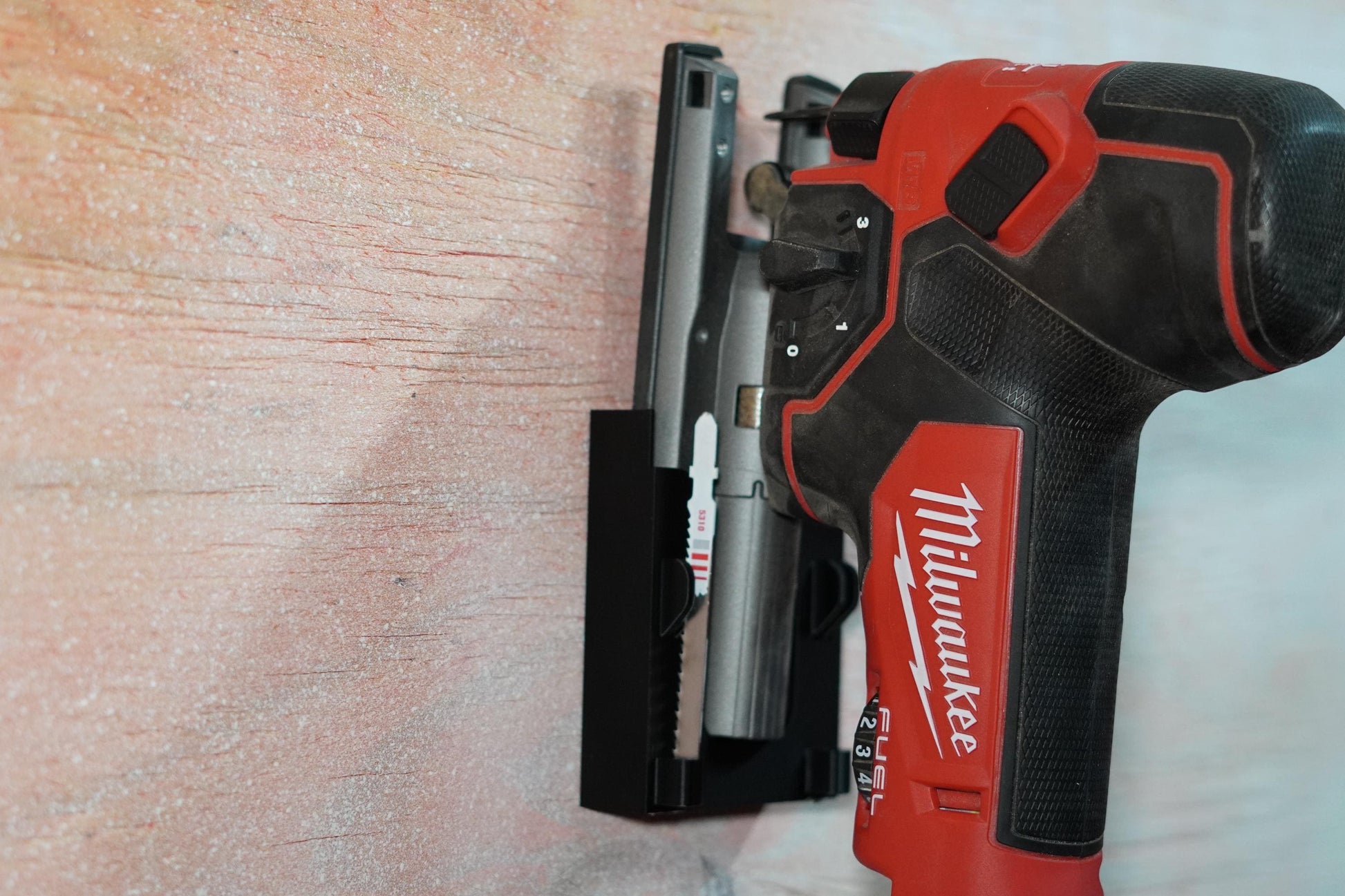 Milwaukee M18 jigsaw in black 3D printed mount from side view (etsy image id: 6837625295)