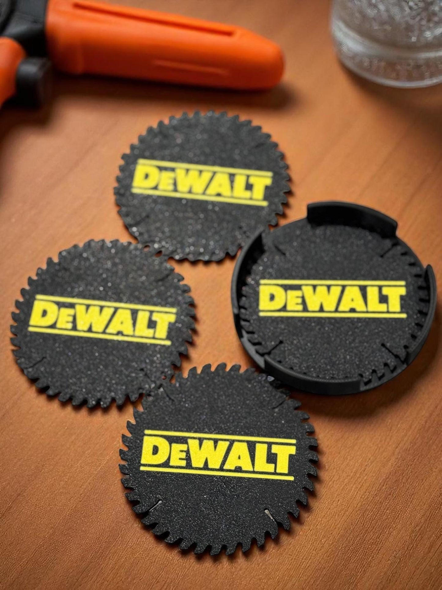 Set of four DeWalt-style coasters next to a black holder on a workshop surface (etsy image id: 6935656736)