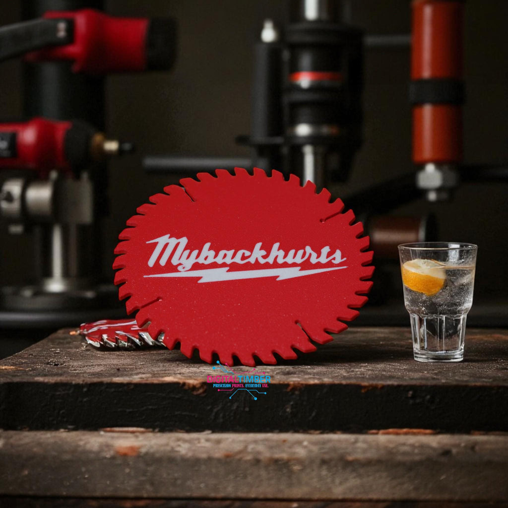 Front view of engraved coaster standing upright with shop equipment and lemon water in background __etsy:7087228038