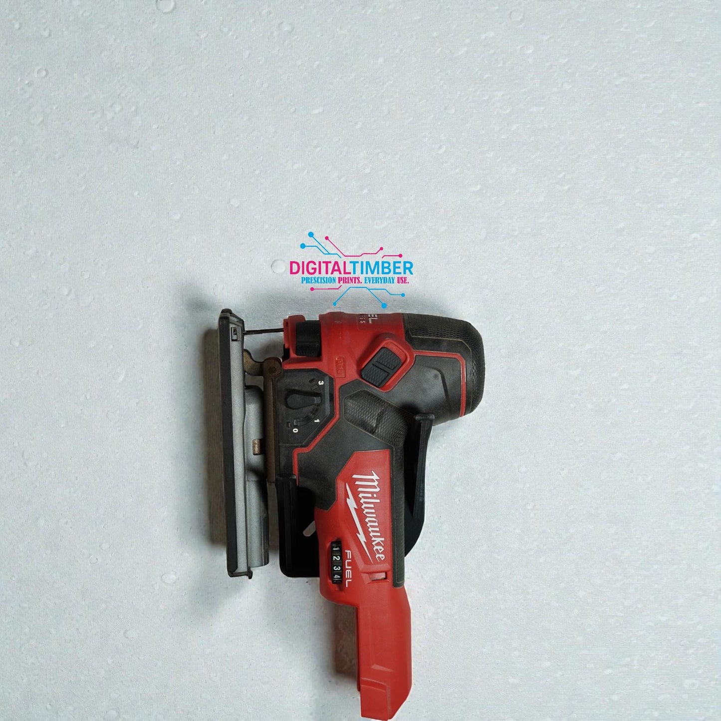 Milwaukee M18 Fuel jigsaw placed vertically on 3D printed tool mount against wall (etsy image id: 7490932097)