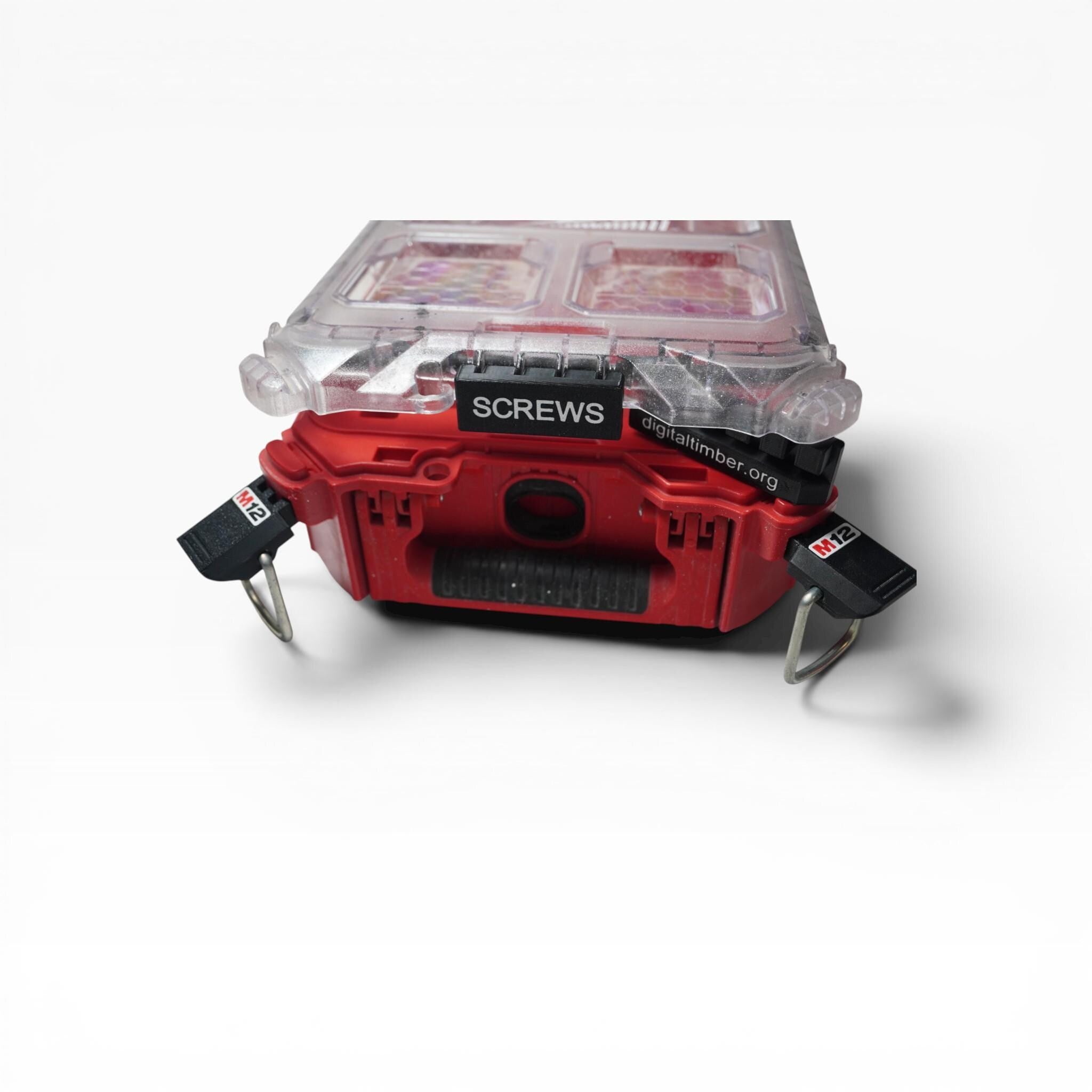 A red and clear Milwaukee Packout organizer is shown from the front, with a black label reading "SCREWS" attached to its front handle, and a second label on the back reading "digitaltimber.org". __etsy:8332158907