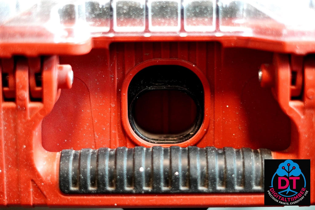 A close-up view of the inside of a red Milwaukee Packout box shows a black rectangular opening and a textured black rubber strip. __etsy:8360986147