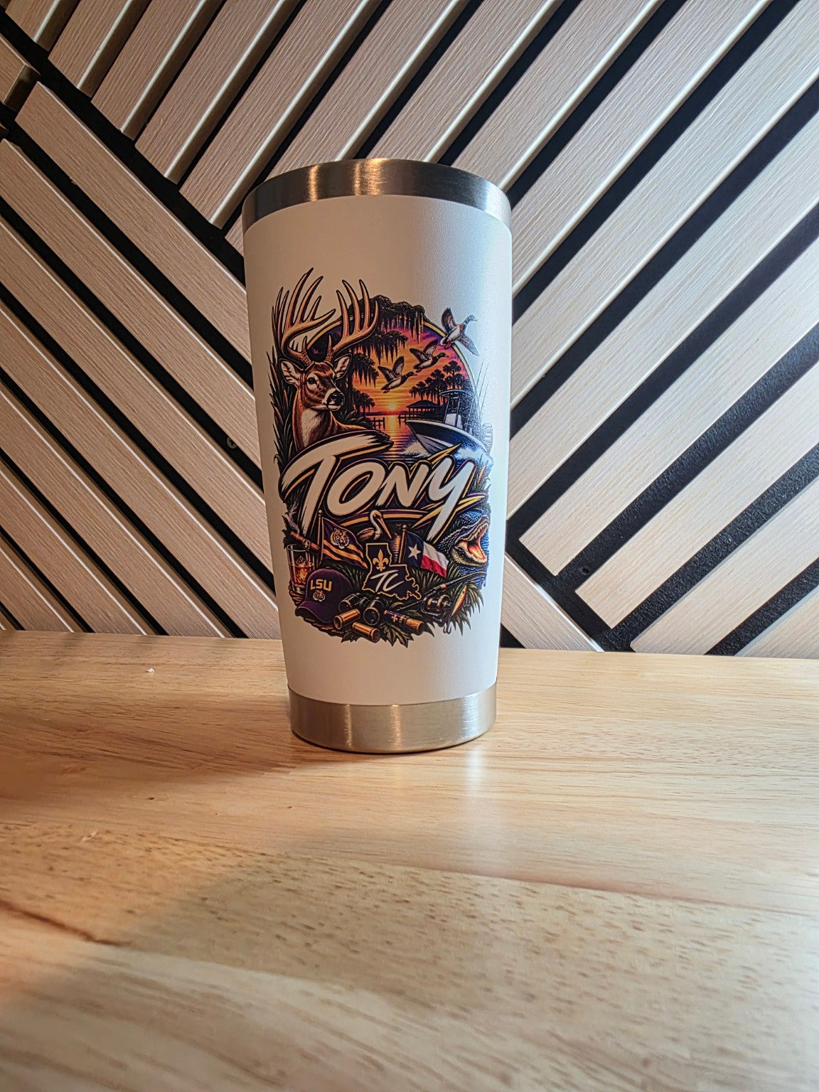 White tumbler with the name Tony and a colorful outdoor-themed illustration featuring a deer and ducks.