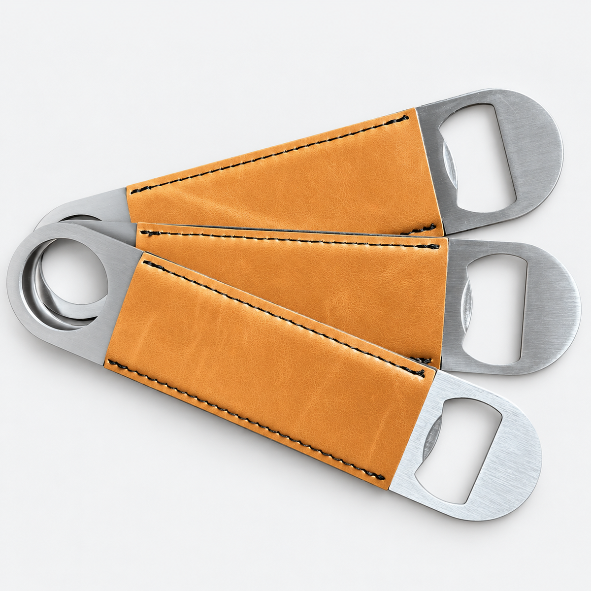 Buckskin leatherette bottle openers before custom UV printing, light gray background