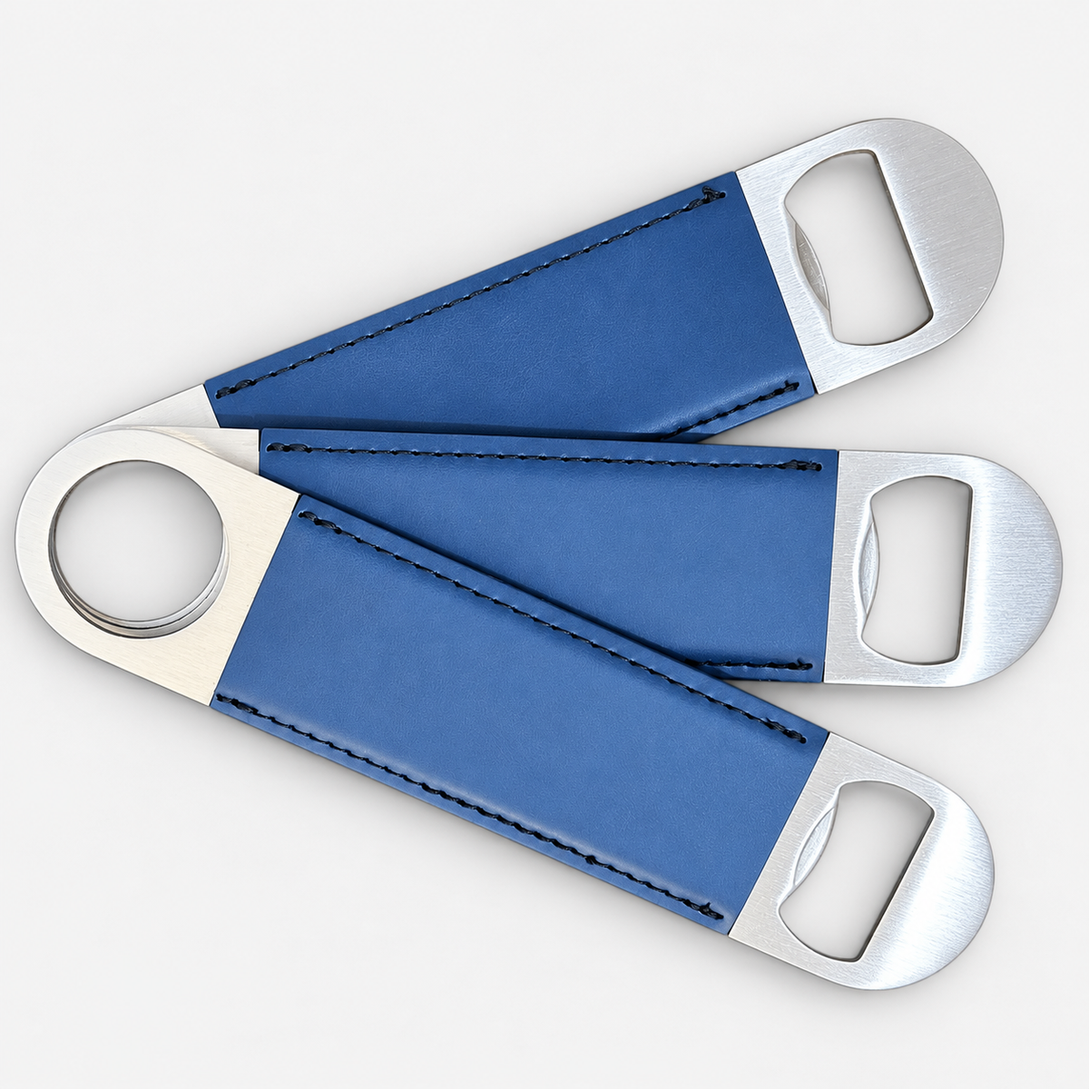 Indigo leatherette bottle openers before custom UV printing, light gray background