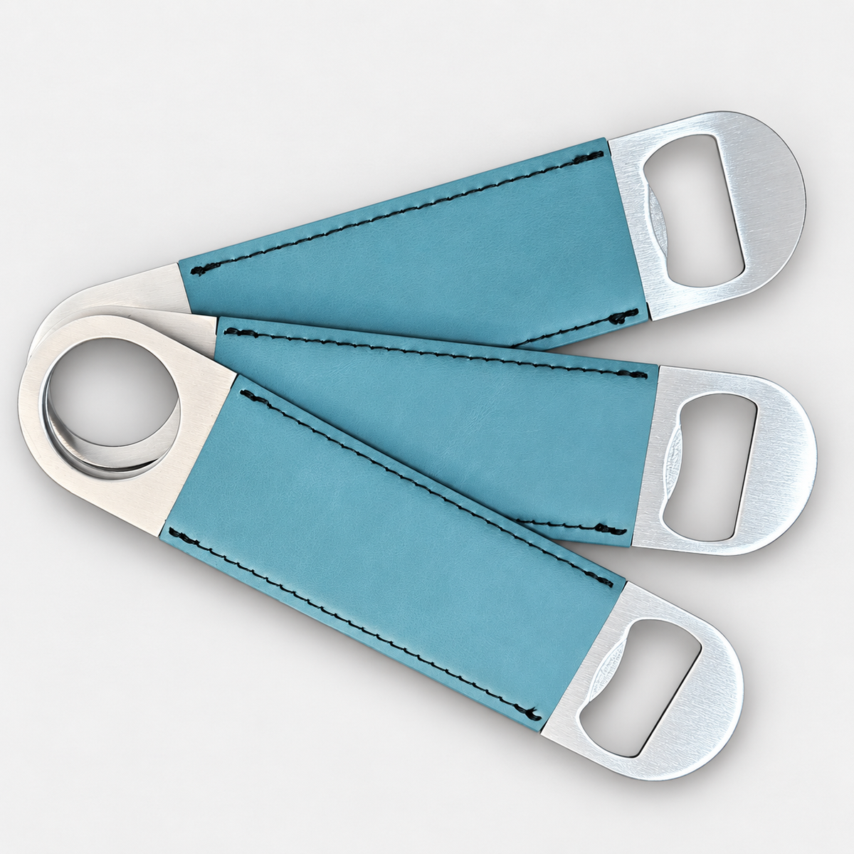 Topaz leatherette bottle openers before custom UV printing, light gray background